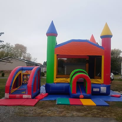 Colorful castle bounce house combo with slide in Martinsburg WV